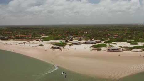 Aerial:-The-lagoon-of-Atins,-Brazil-with-people-kitesurfing