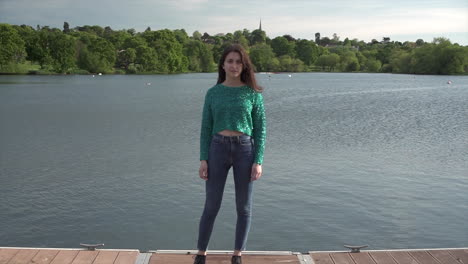 Gorgeous-Italian-fashion-model-posing-in-her-outfit-in-front-of-a-lake-in-London-at-golden-hour
