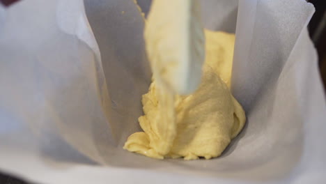 Pastry-chef-pouring-cake-batter-into-a-baking-tray-in-slow-motion