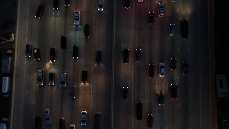 Medium-traffic-at-night-on-the-freeway-in-Los-Angeles---Push-from-above