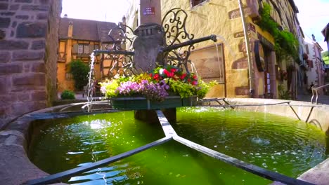 Dramatic-slow-motion-video-of-a-historic-fountain-in-an-old-french-town