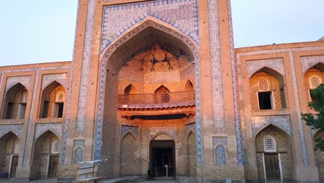 The-evening-sun-lightling-up-the-beautiful-madrasain-Khiva,-Uzbekistan,-central-Asia