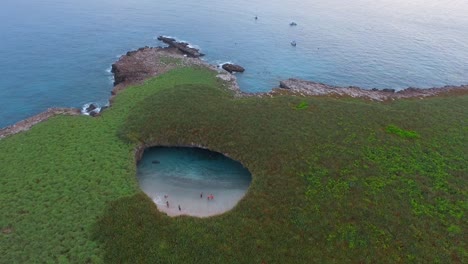 Aerial-shot-of-the-hidden-beach-in-the-Marietas-Islands,-Nayarit,-Mexico