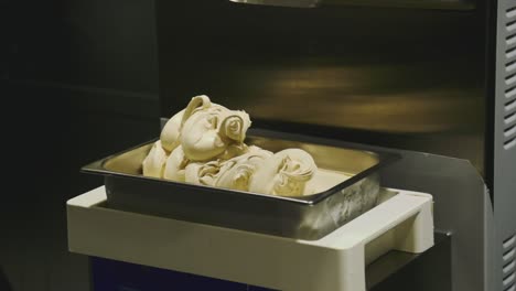 Cooking-gelato-ice-cream-footage-with-a-part-of-using-a-machinery-and-taking-out-the-material-gently