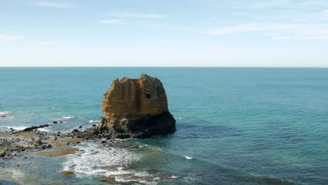 Limestone-stack-located-at-an-Australian-coastal-beach-shot-from-above