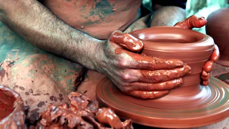 Medieval-Potter-using-potters-wheel-and-hands-crafting-earthenworks-clay-molds-porcelains-ceramics-Producing-cooking-pots,-storage-containers-decorative-objects-guild-member-Medieval-Craft-Ocupation