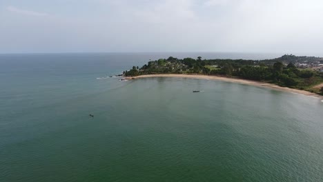 Aerial-shot-of-the-coast-and-horizon-of-Mermaids-Bay-in-the-Southwest-Africa-San-Pedro-Ivory-Coast-North-Atlantic-Ocean
