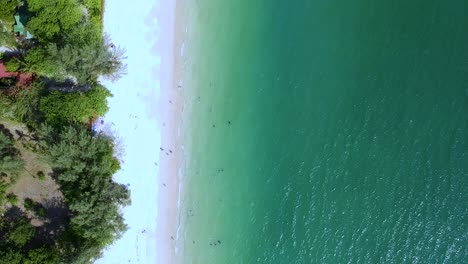 Aerial-vertical-shot-over-turquoise-sea-at-Railay-Beach,-Ao-Nang,-Krabi,-Thailand