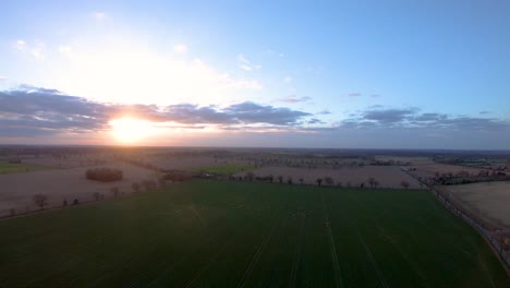 Aerial-Drone-Footage-of-a-sunset-over-a-Norfolk-field-full-of-Sheep