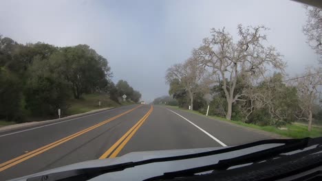 Time-lapse-hyperlapse-driving-through-fog-in-California-hills-in-Los-Padres-National-Forest