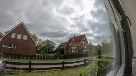 Time-Lapse-by-the-window-with-the-clouds-passing-and-the-sun-moving