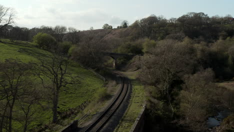 Low-Aerial-Flyover-of-Heritage-Railway-Line-in-Rural-North-York-Moors,-England