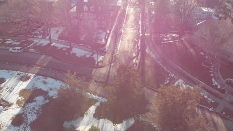 aerial-footage-following-a-car-on-a-nice-neighborhood-during-a-sunny-afternoon