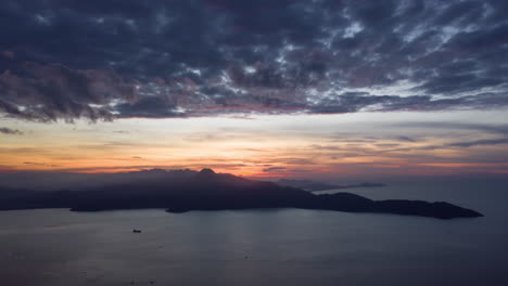 Aerial-Time-Lapse-of-Countryside-Landscape-at-Sunset-with-Mountains-and-Ocean