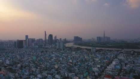 Evening-drone-footage-flying-from-right-to-left-over-district-4-of-Ho-Chi-Minh-City-showing-the-suburban-architecture-and-terrace-houses-in-the-twilight
