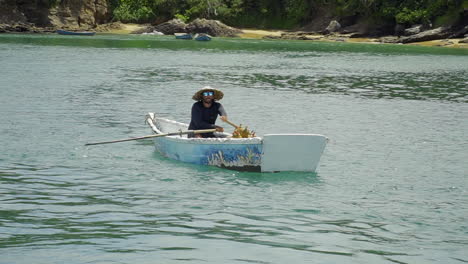 Shot-of-Local-selling-pinacoladas-on-small-boat---Buzios---Rio-De-Janeiro---Brazil