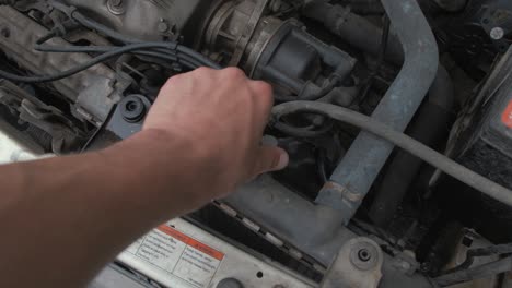 Removing-radiator-cap-and-replacing-under-hood-of-car-POV