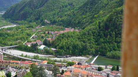 Aerial-panoramic-view-of-Varallo-Sesia-from-the-Sacred-Mountain-of-Varallo,-a-christian-devotional-complex,-a-unesco-world-heritage-si-in-Italy