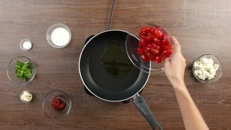 Top-down-shot-of-a-table-with-single-hob-and-large-pan-with-olive-oil-on-it