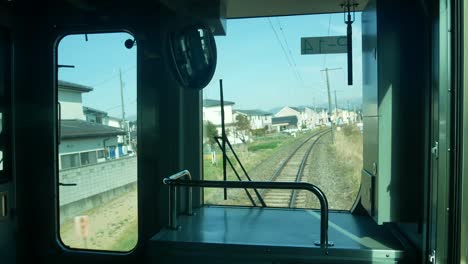 Landscape-view-of-the-inside-moving-train-from-the-front-of-the-train-see-landscape-view-outside-of-the-village-town-countryside-of-tokyo-city