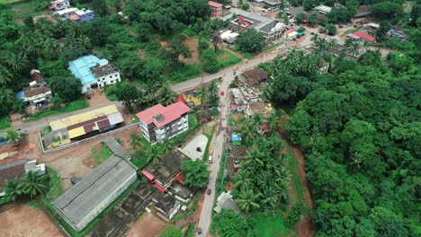 Aerial-flying-over-traffic-in-the-suburb-of-Chikmagalur,-India