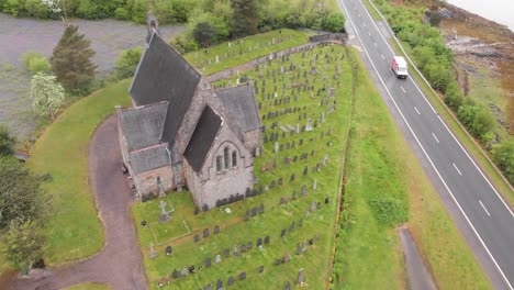 St-John's-Episcopal-Church,-Ballachulish-in-the-Scottish-Highlands-surrounded-with-graves