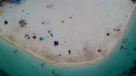 Aerial-top-down-of-white-sand-and-turquoise-blue-sea-on-White-beach,-Moalboal,-Cebu,-Philippines