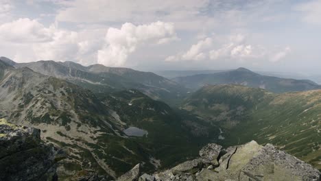 Panning-shot-showing-panoramic-view-of-the-valley-and-Rohacske-plesa-lakes-in-West-Tatras,-Slovakia-on-a-summer-day