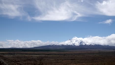 Wide-establishing-shot-of-Mount-Ruapehu-surrounded-by-beautiful-clouds-in-New-Zealand