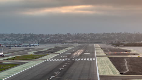 Time-lapse-of-planes-landing-and-taking-off-at-San-Diego-International-Airport,-showing-a-15-minute-timeframe-condensed-to-a-few-seconds,-indicating-difficult-job-of-air-traffic-controllers