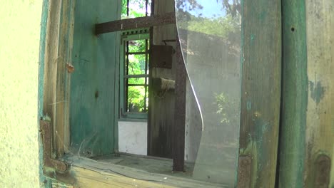 Old-and-abandoned-house-broken-glass-on-window