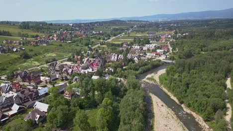 Aerial-view-with-tilt-down-of-the-Zakopane-area-and-river