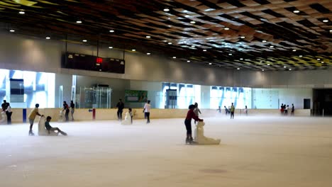 Filipino-families-enjoying-the-ice-skating-facilities-within-the-SM-Seaside-Mall-on-South-Road-Properties,-Cebu-City,-Philippines