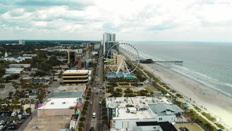 Aerial-Rise-up-Shot-of-Skywheel-at-Myrtle-Beach-in-South-Carolina