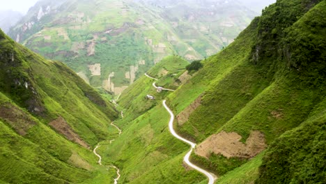 Gorgeous-mountain-road-carved-into-a-steep-valley