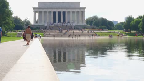 The-front-steps-of-the-Lincoln-Memorial-taken-from-the-reflection-pond-with-people-in-the-foreground