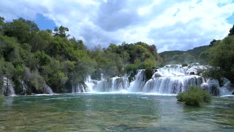 Beautiful-waterfalls-in-the-famous-Croatian-Krka-National-Park-with-flowing-and-rushing-water-in-early-summer