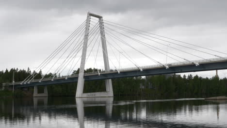The-Kolbäck-Bridge-and-Ume-älv,-in-Umeå,-Sweden,-static-shot-followed-by-pan-right,-10-bit