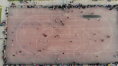Vertical-aerial-view-skating-rink-with-many-people-montevideo-uruguay