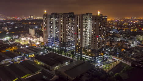 Aerial-4k-Hyperlapse-of-a-large-modern-residential-development-in-the-suburbs-of-Ho-Chi-Minh-City-in-Vietnam-showing-the-City-Skyline,-Saigon-River,-industrial---residential-surroundings
