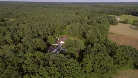 A-drone-flight-over-the-Kempen-forest-and-village-in-Belgium-near-to-Antwerp