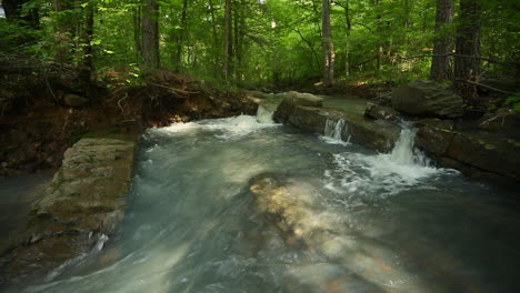 Three-small-waterfalls-flowing-over-a-rock-on-a-creek-in-the-Ouachita-mountains-Arkansas