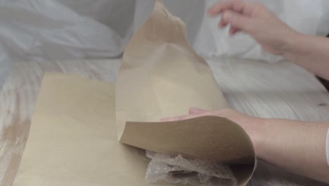 Wrapping-item-in-bubble-wrap-and-paper