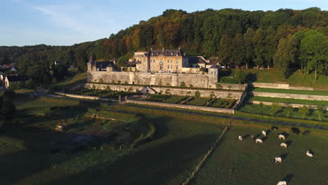 AERIAL:-Shot-of-Chateau-Neercanne-bathing-in-the-morning-sun