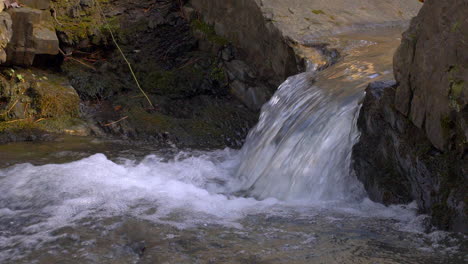 Slow-motion-close-up-footage-of-a-small-waterfall