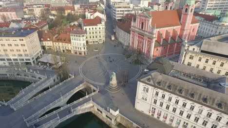 Aerial-view-of-Tromostovje,-Triple-Bridge-of-Ljubljana-on-the-river-Ljubljanica,-center-of-the-city