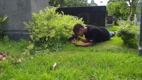 a-young-amateur-photographer-doing-his-macro-shoot-outdoor