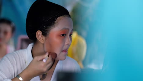 Chinese-Opera-Actor-Applies-Make-Up-Backstage