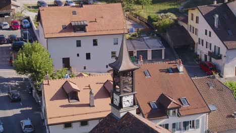 School-bell-tower-in-typical-Swiss-village-in-Lavaux-vineyard-Aran,-Lavaux---Switzerland