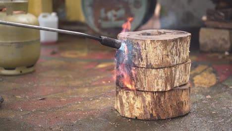 Slow-motion-craftsman-blow-torch-a-tree-log